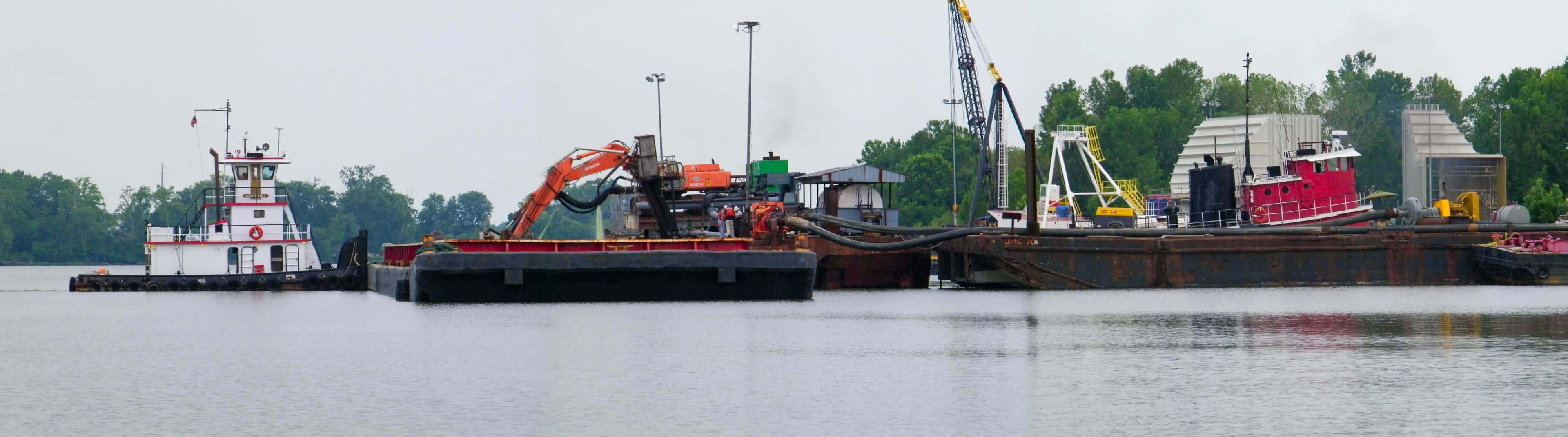 Tugs, barges and hydraulic offloading equipment moored at Port Tobacco on the James River
